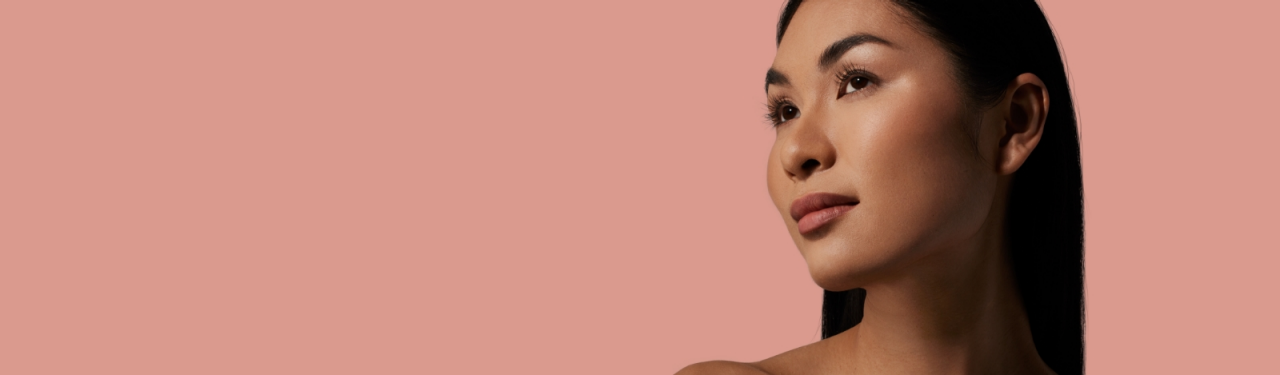 Woman with clear skin looking to the right
